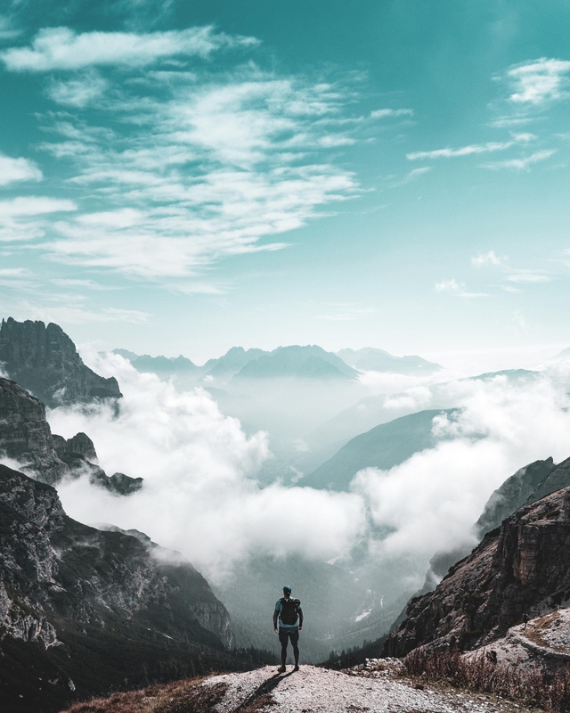 A hiker looking across a mountain valley